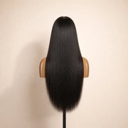 Back view of the Hugyoo Natural Black Light Yaki glueless human hair wig showing its length and texture.