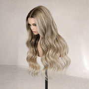 Side view of the Hugyoo Ash Blonde Soft Wave glueless human hair wig on a mannequin.