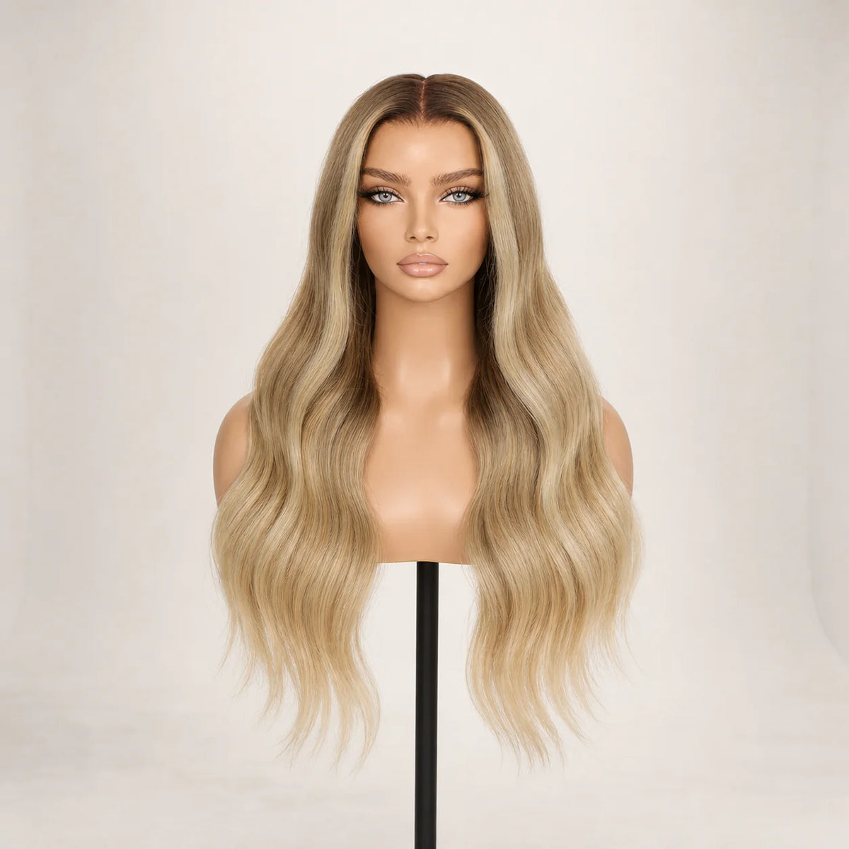 Front view of the Hugyoo Dirty Blonde Wave glueless human hair wig on a mannequin.
