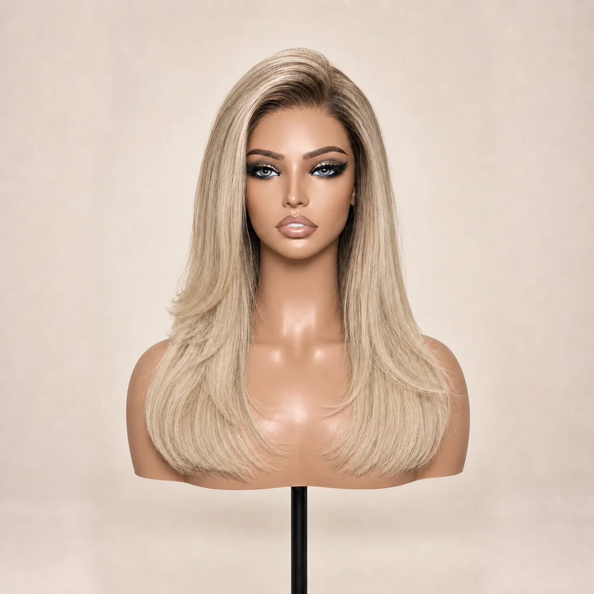 Front view of the Hugyoo Blonde Long Layered Blowout glueless human hair wig on a mannequin.