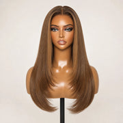 Front view of the Hugyoo Honey Brown Caramel Highlights Layered Straight glueless human hair wig on a mannequin.
