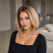 Woman wearing the Hugyoo Dark Root Blonde Short Bob glueless human hair wig in a lifestyle setting.