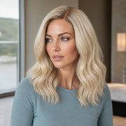 Woman wearing the Hugyoo Blonde Bob Side Part glueless human hair wig in a lifestyle setting.