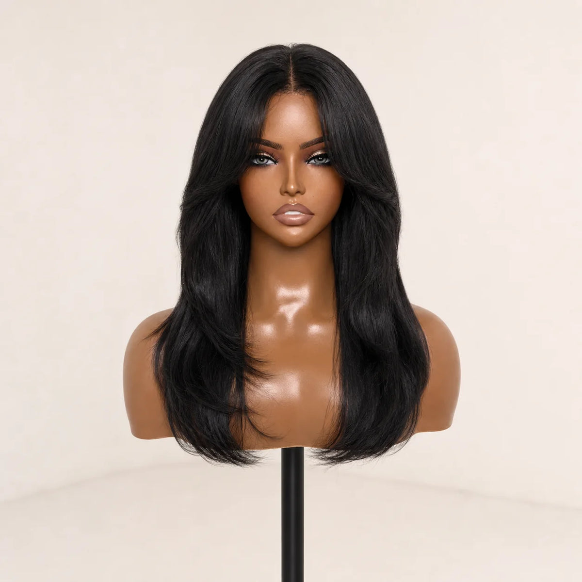 Front view of the Hugyoo Natural Black Layered Curtain Bangs glueless human hair wig on a mannequin.