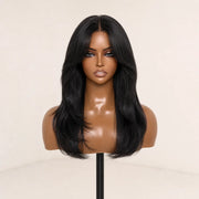 Front view of the Hugyoo Natural Black Layered Curtain Bangs glueless human hair wig on a mannequin.