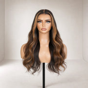 Front view of the Hugyoo Brown to Bronde Wavy Face Framing glueless human hair wig on a mannequin.