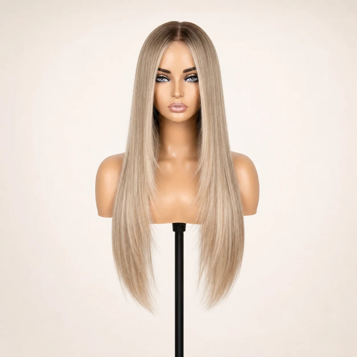 Front view of the Hugyoo Blonde Long Layers glueless human hair wig on a mannequin.