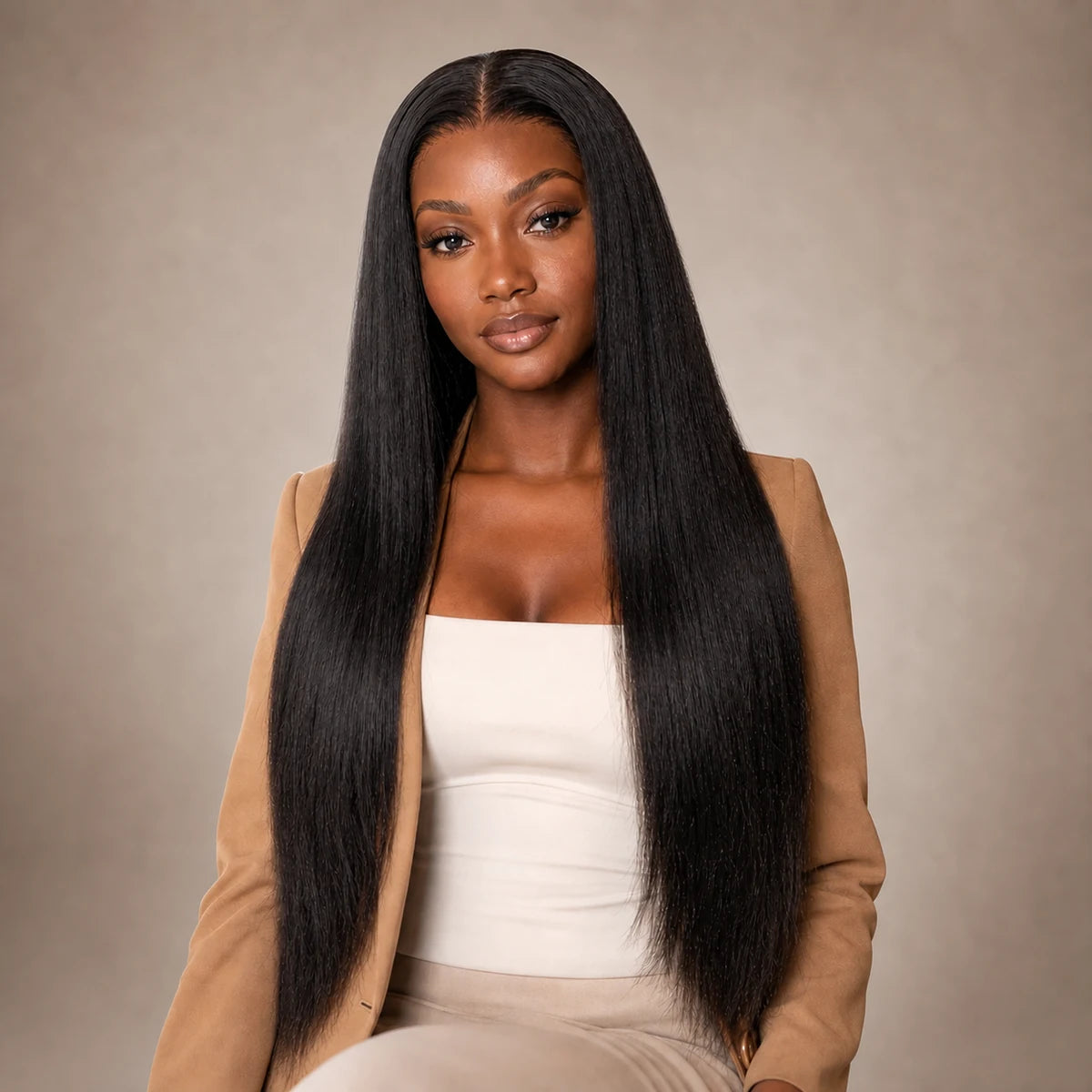 Black woman wearing long natural black Light Yaki straight hair, representing Hugyoo Straight & Yaki wigs.