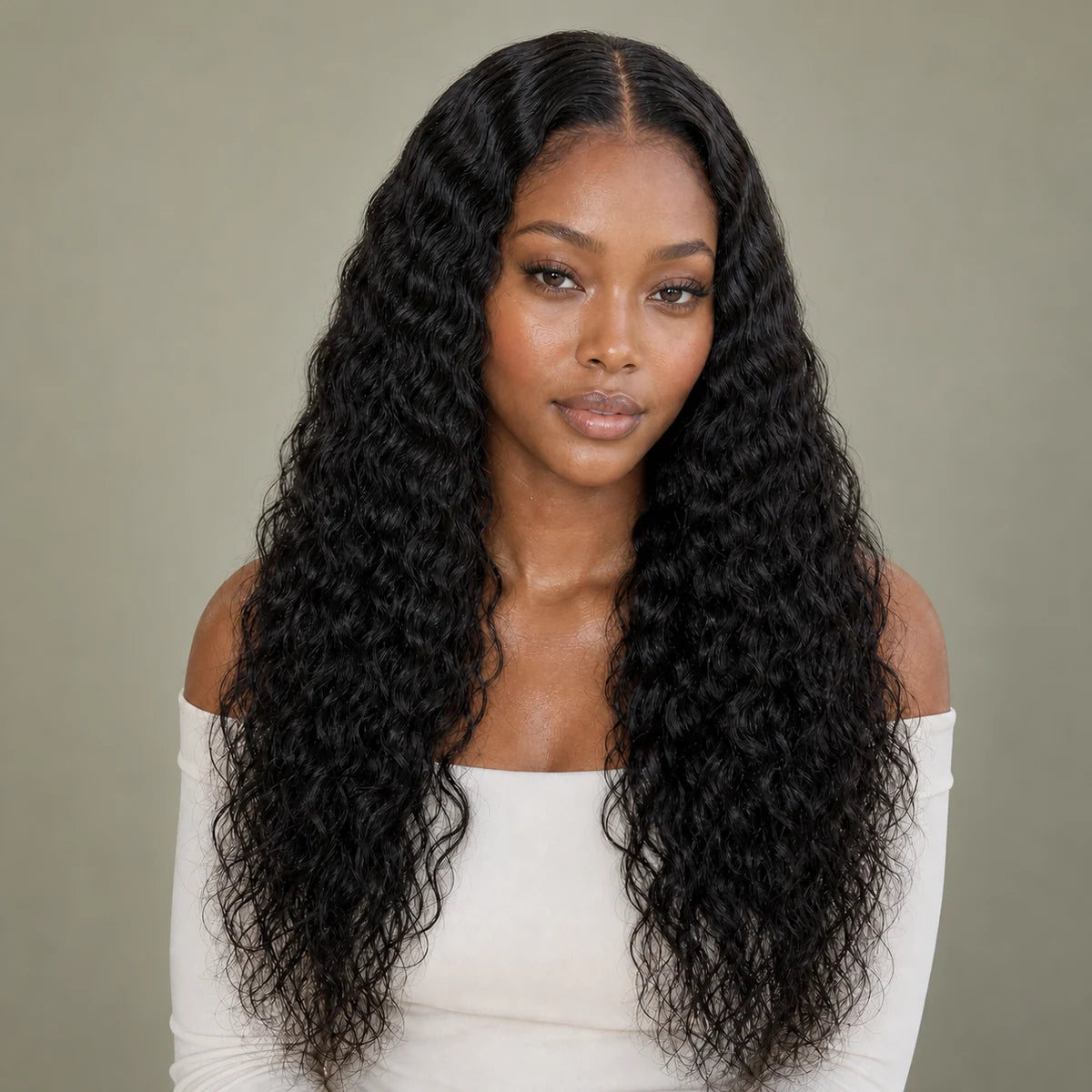 Black woman wearing long natural black deep waves, representing Hugyoo Wet, Water & Deep Waves wigs.