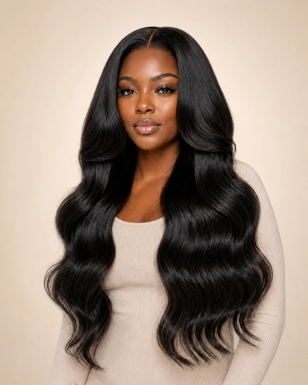Black woman wearing long natural black body waves, representing Hugyoo Natural Black wigs.